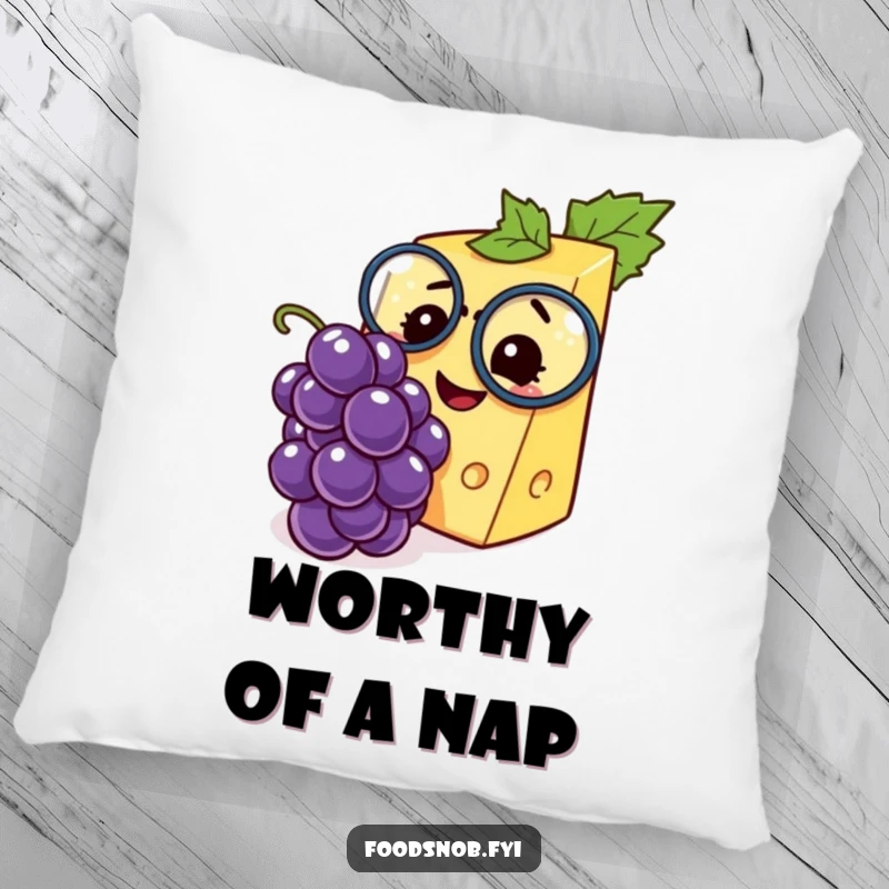 Funny pillow with an elegant cheese wedge character and monocle, admiring a tiny grape with great joy and amusement.