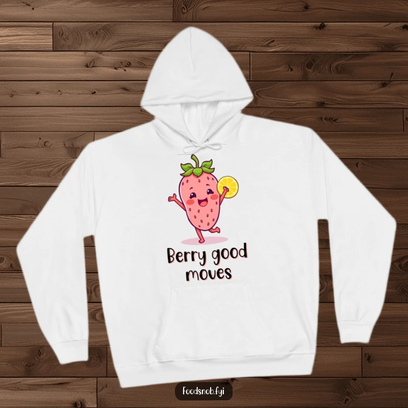Funny hoodie design of a strawberry character dancing merrily with a lemon wedge, offering warmth and a dose of cheerful fun.