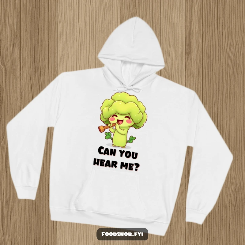 Funny hoodie with a happy broccoli sprout character playing a tiny flute, offering warmth and whimsical charm. A unique veggie apparel.