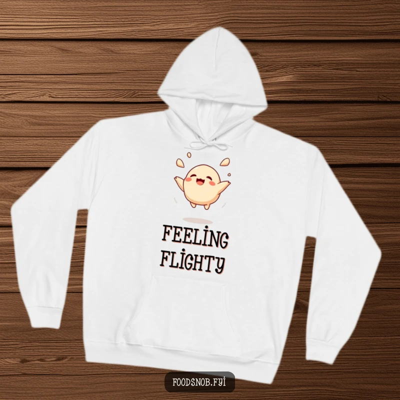 Funny hoodie featuring a delighted dumpling being tossed high in the air, providing warmth and a dose of lightheartedness.
