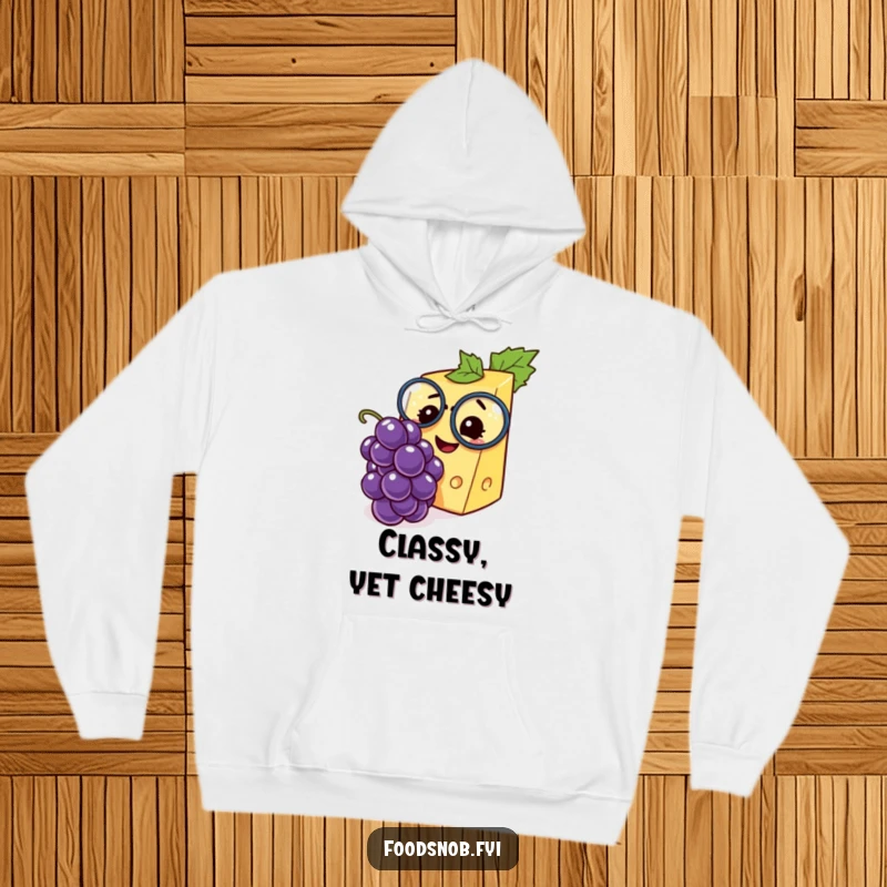 Funny hoodie featuring a fancy cheese wedge with a monocle, joyfully examining a tiny grape, perfect for cozy, humorous moments.