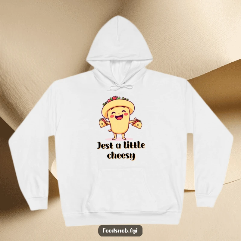 Funny hoodie of a cheerful taco character juggling tiny tacos, embodying playful culinary skills and cozy warmth.
