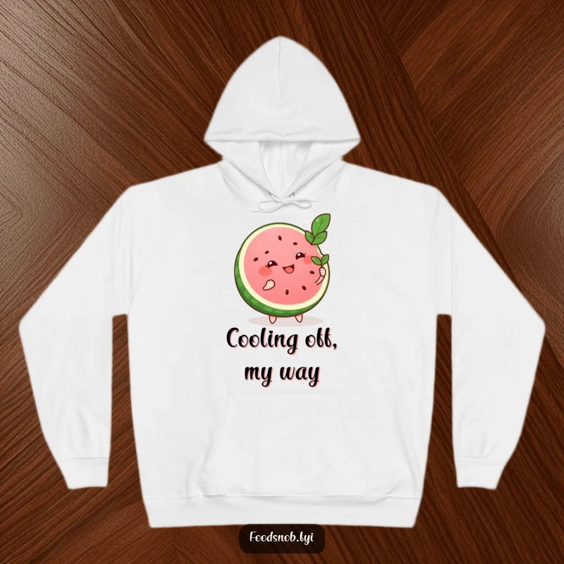 Funny hoodie featuring a smiling watermelon slice character fanning itself with a tiny leaf, offering comfort and a humorous summer theme.